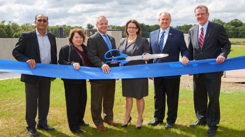 Members of the American Water New Jersey team celebrate the completion of a $37 million flood protection project, which will help ensure the continued protection and sustainability of water supply for more than 1 million residents.